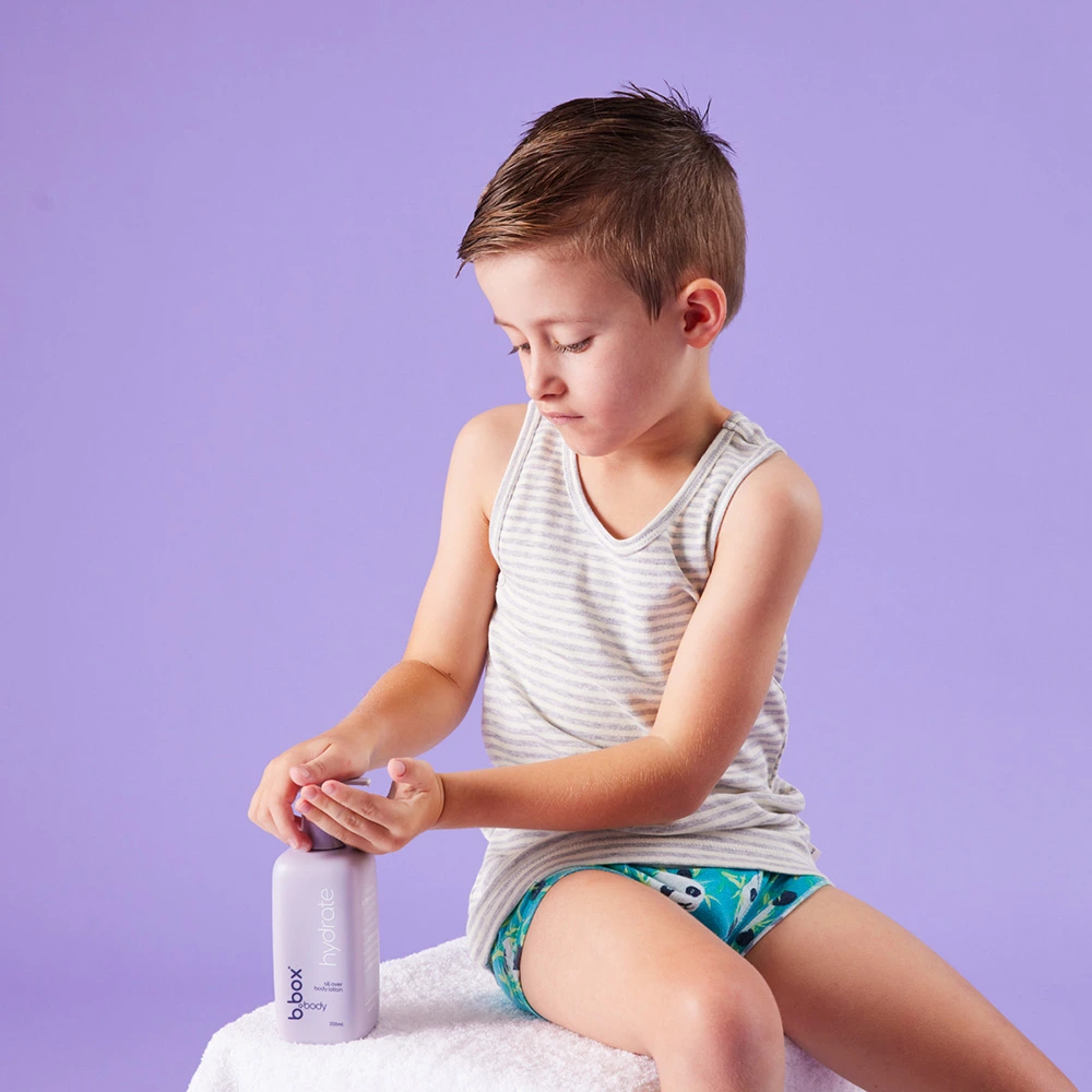A child using the hydrate, all-over body lotion
